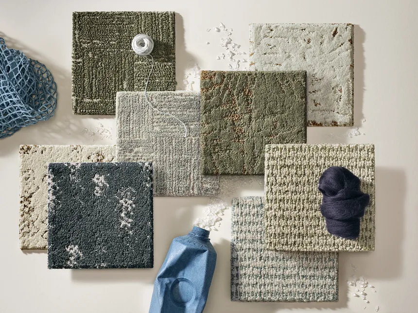 Diverse carpet color options for versatile interior design Circular display of carpet swatches in various colors including blue, green, beige, pink, and red