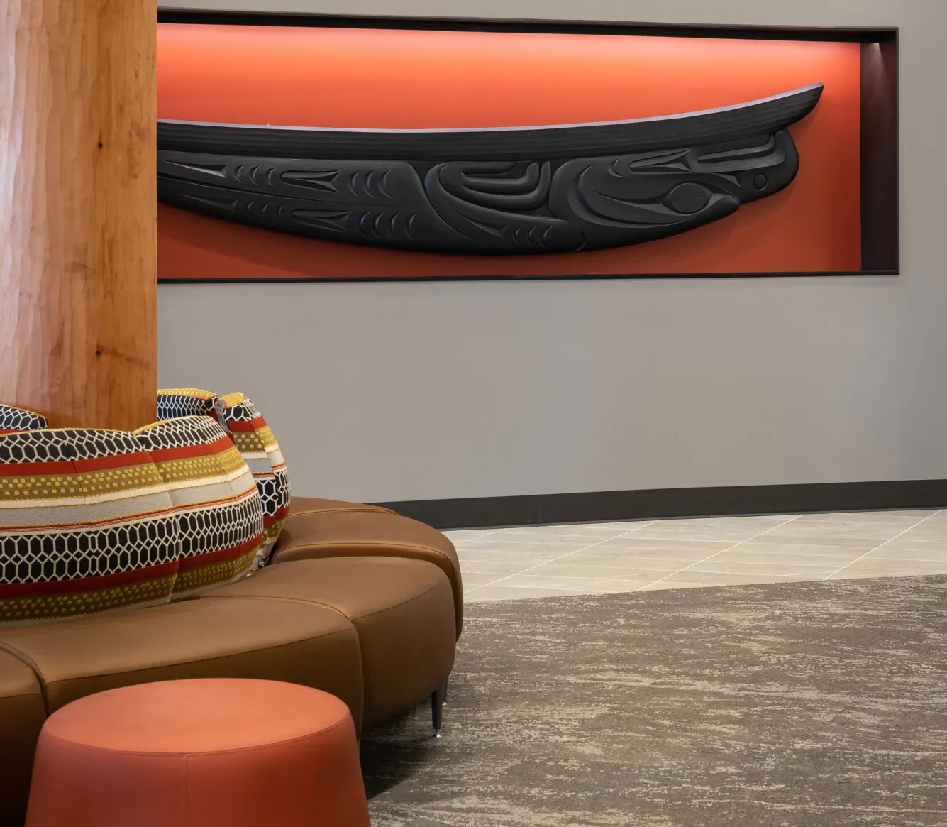 Modern lobby with patterned carpet and leather seating