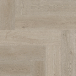 A light brown vinyl floor in herringbone pattern