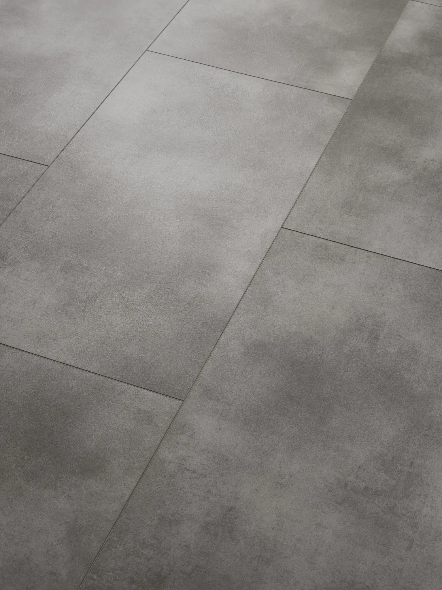 Modern staircase with gray luxury vinyl tile flooring in a minimalist interior setting