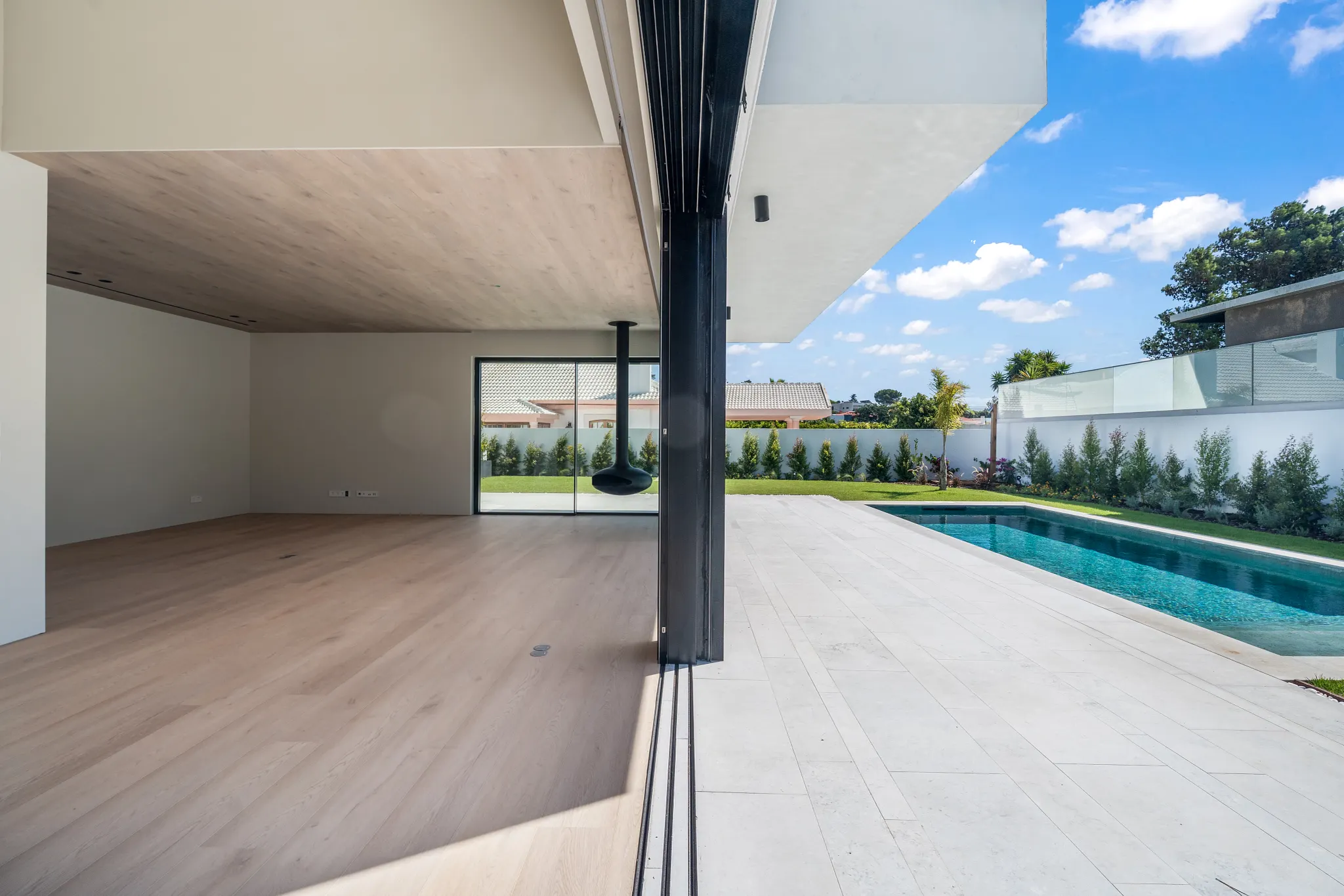 Modern living room with outdoor terrace and swimming pool