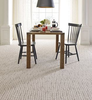 Dining room with broadloom carpet