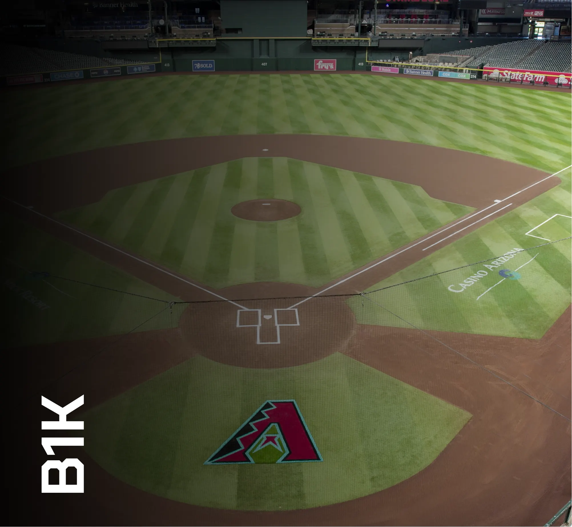 Artificial turf baseball field with B1K/Truhop branding