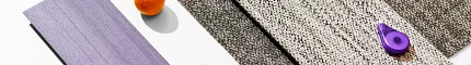 Versatile carpet tile options for modern interiors Assorted carpet tile samples in red, purple, and beige colors