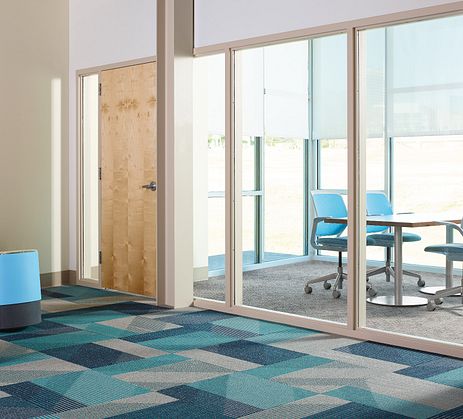 Colorful, geometric carpet tile in a modern office