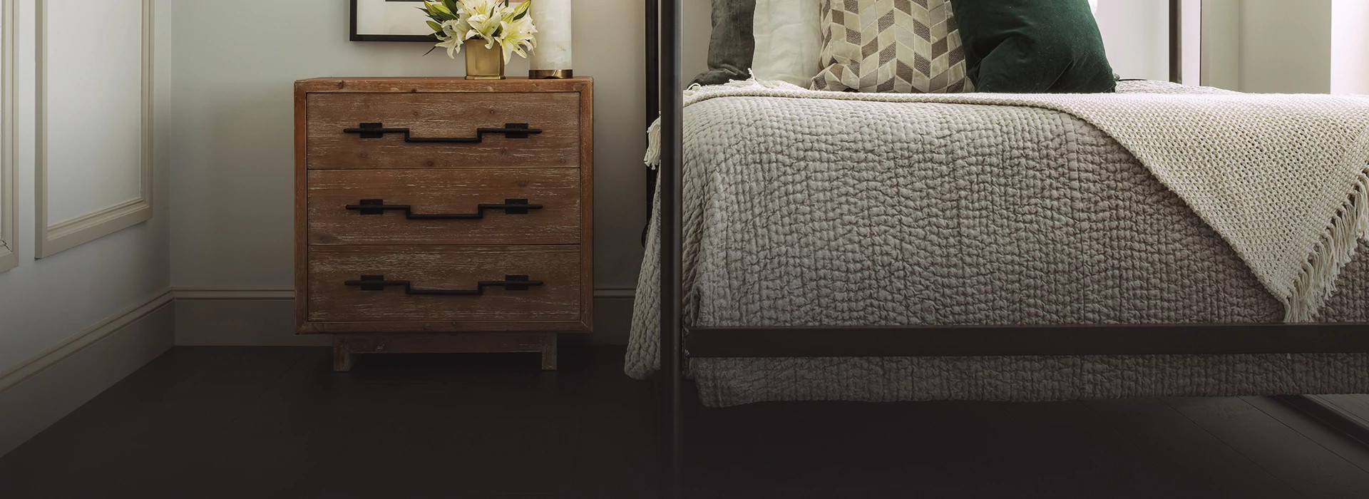 Modern bedroom with dark hardwood