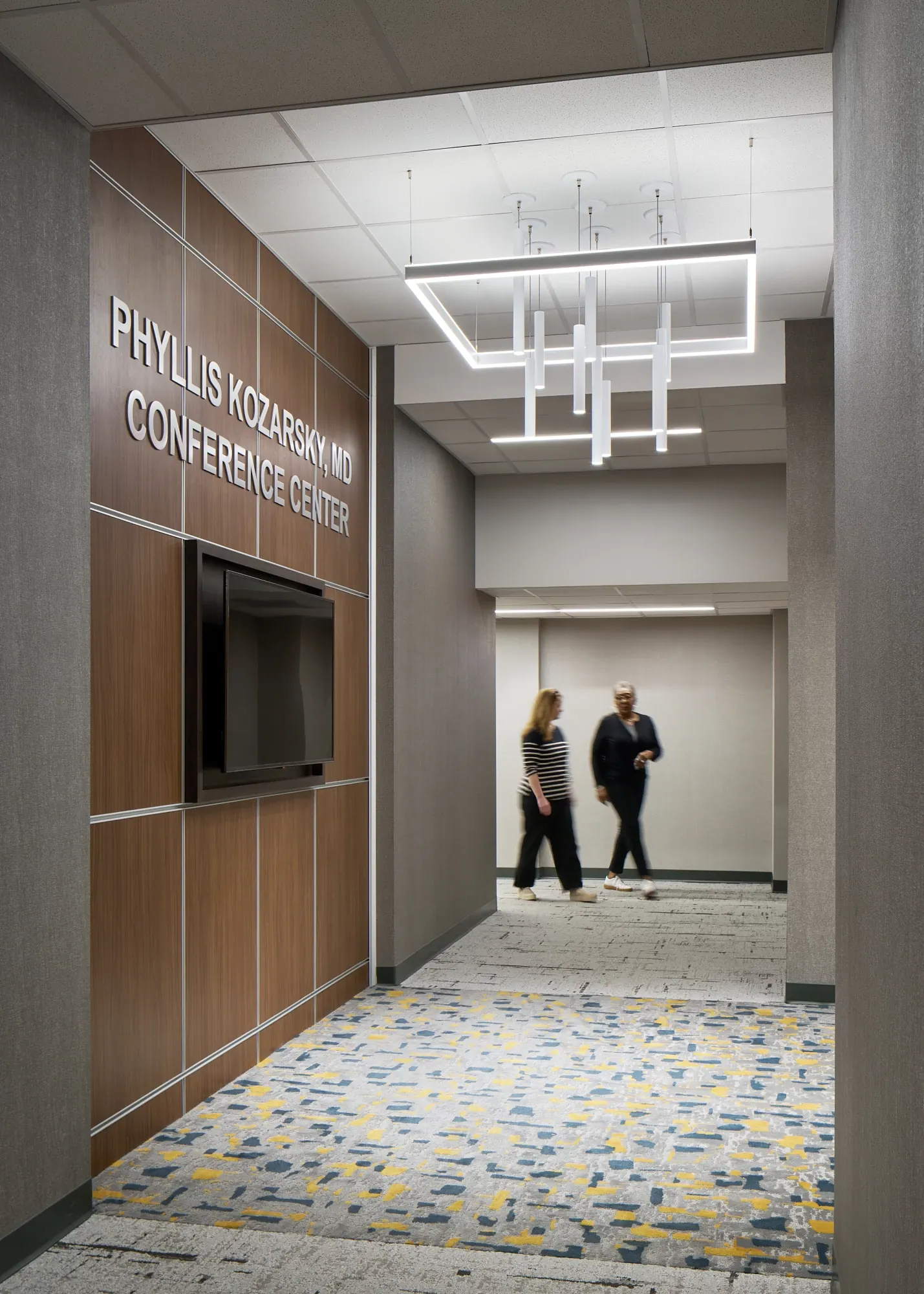 Conference center hallway with patterned carpet flooring