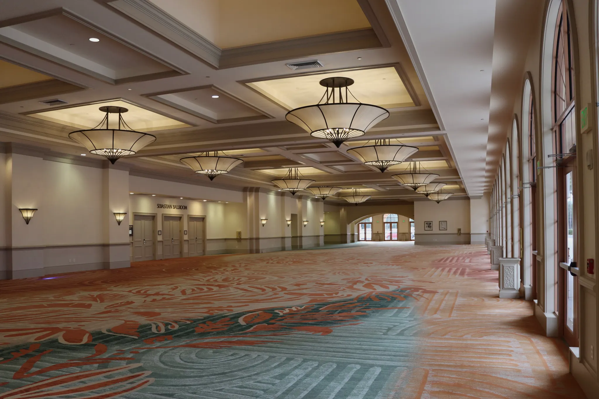 Spacious ballroom with patterned carpet flooring