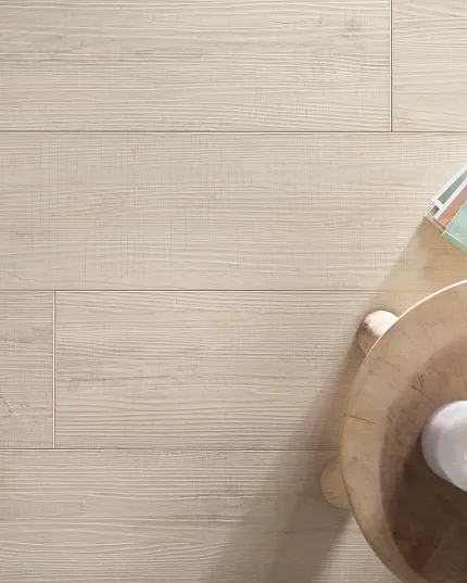 Light Wood-Look Flooring - Sound Core® Construction, 72.05x8.98 inch - Cozy and Durable. Light wood-look flooring with a natural finish, featuring a cozy setting with candles and reading glasses on a wooden table, 72.05x8.98 inch dimensions, Sound Core® construction, Direct Ship Internat