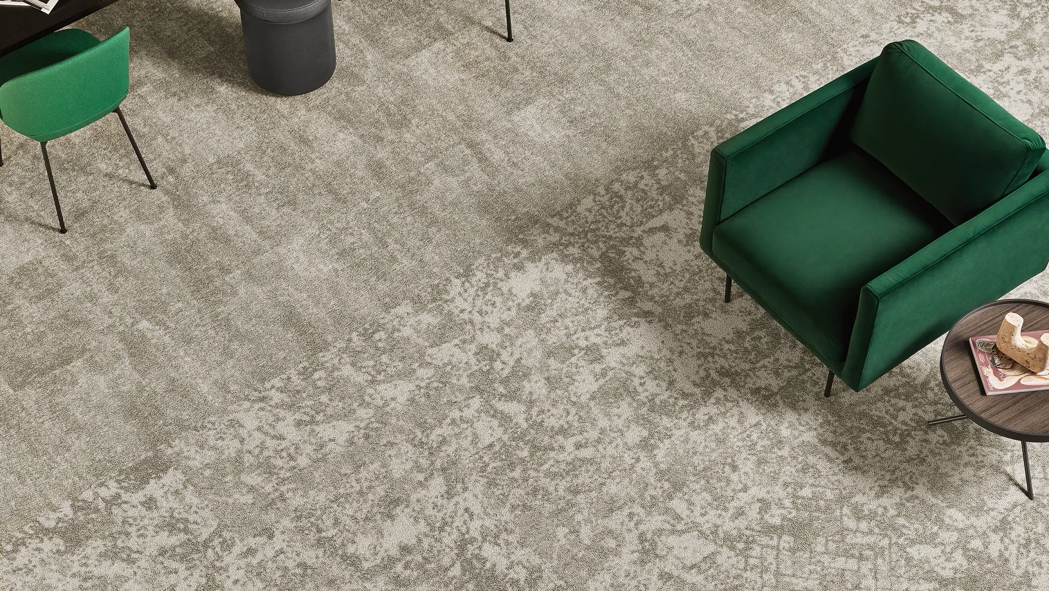 Modern office space with yellow, gray, and green carpet tiles