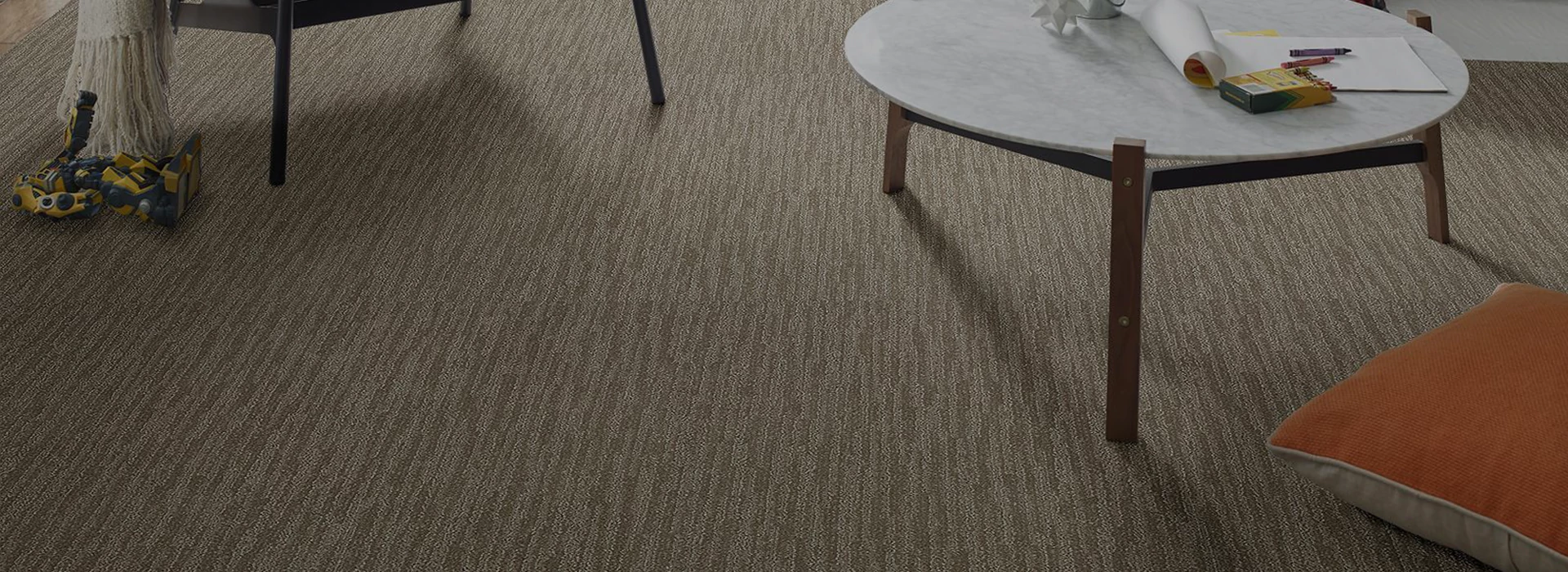 Multicolored, patterned Carpet Tile room scene with a small table on the right side