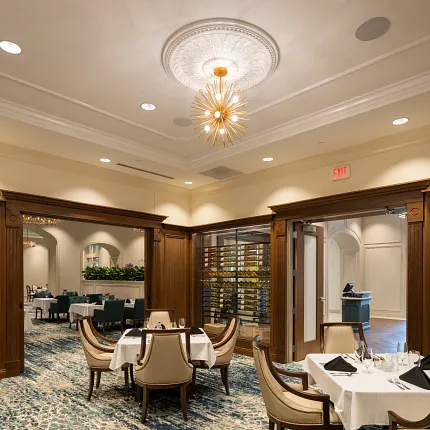 Luxurious carpet flooring in sophisticated dining setting Elegant dining room with plush carpet and wooden accents
