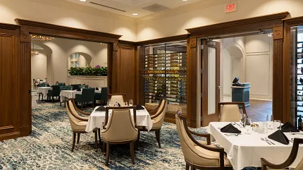 Luxurious carpet flooring in sophisticated dining setting Elegant dining room with plush carpet and wooden accents