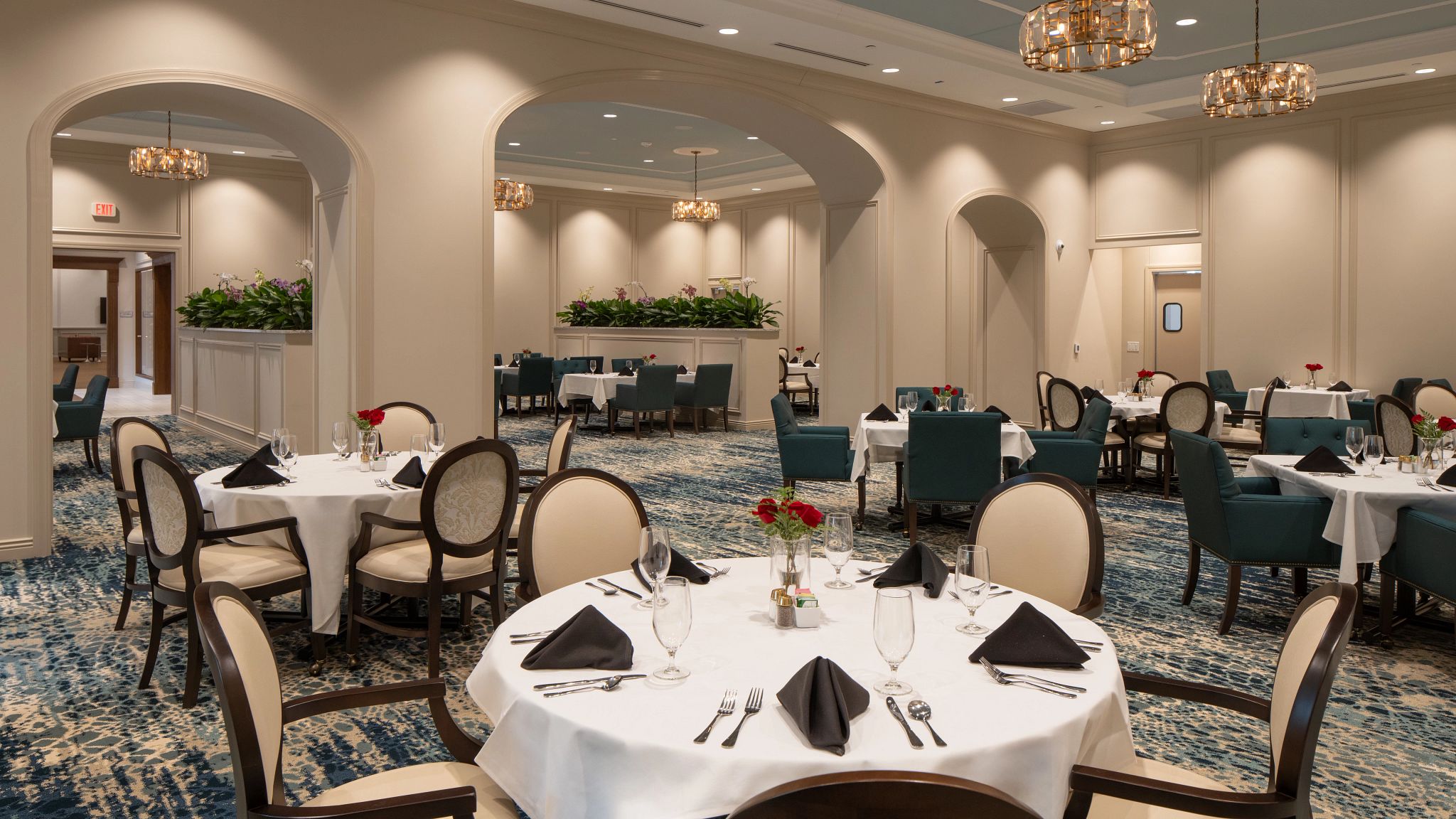 a dinning hall in a commercial senior living housing area, featuring custom broadloom carpet