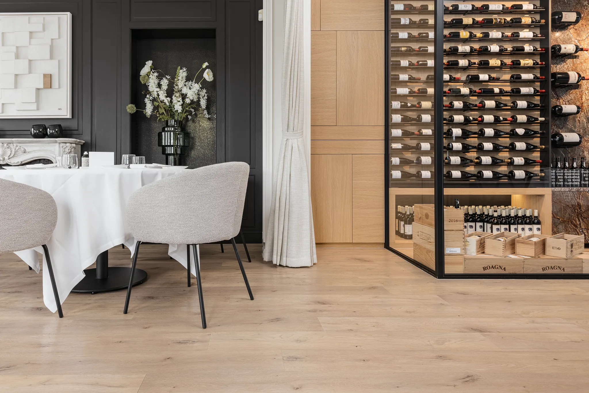 Modern dining room with luxury vinyl plank flooring and wine display