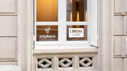 COREtec Floors and Triplaco Window Display Exterior view of a window with COREtec Floors and Triplaco branding