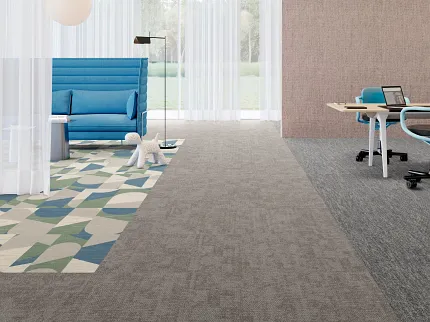 Stylish carpet design for contemporary workspaces Modern office space with geometric patterned carpet and blue seating