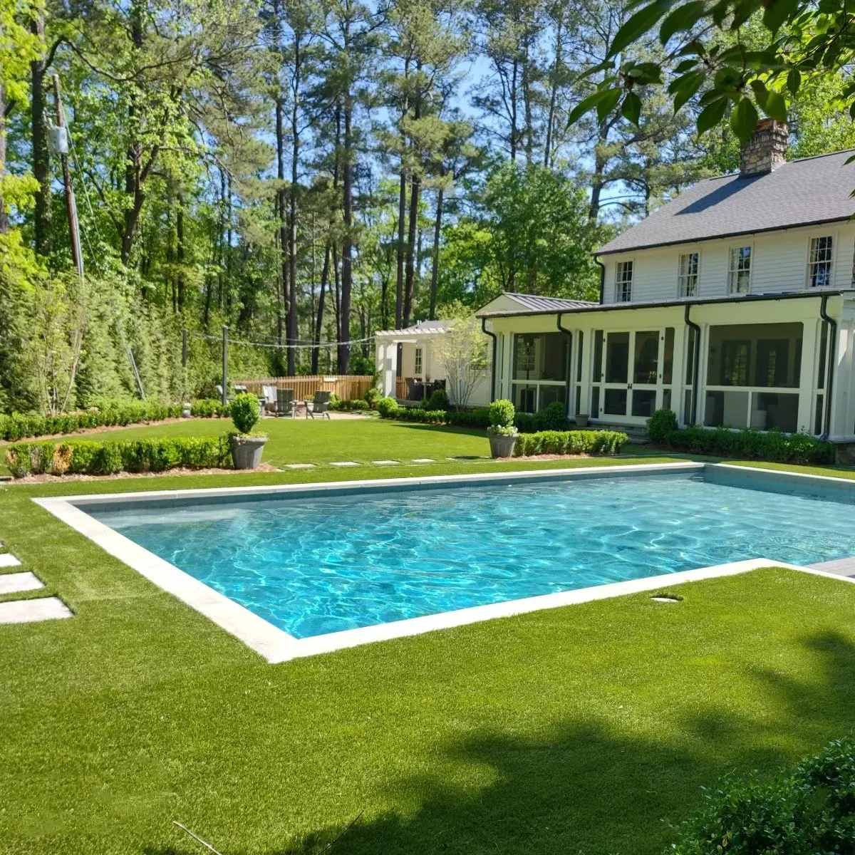Backyard with swimming pool and artificial grass