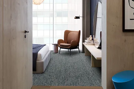 Stylish flooring solutions for hospitality interiors Modern guestroom with custom carpet and hardwood flooring