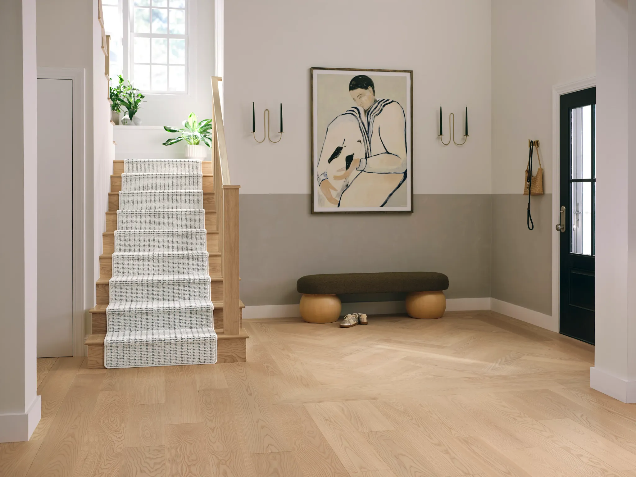 Modern hallway with light wood flooring and synthetic carpet stair runner