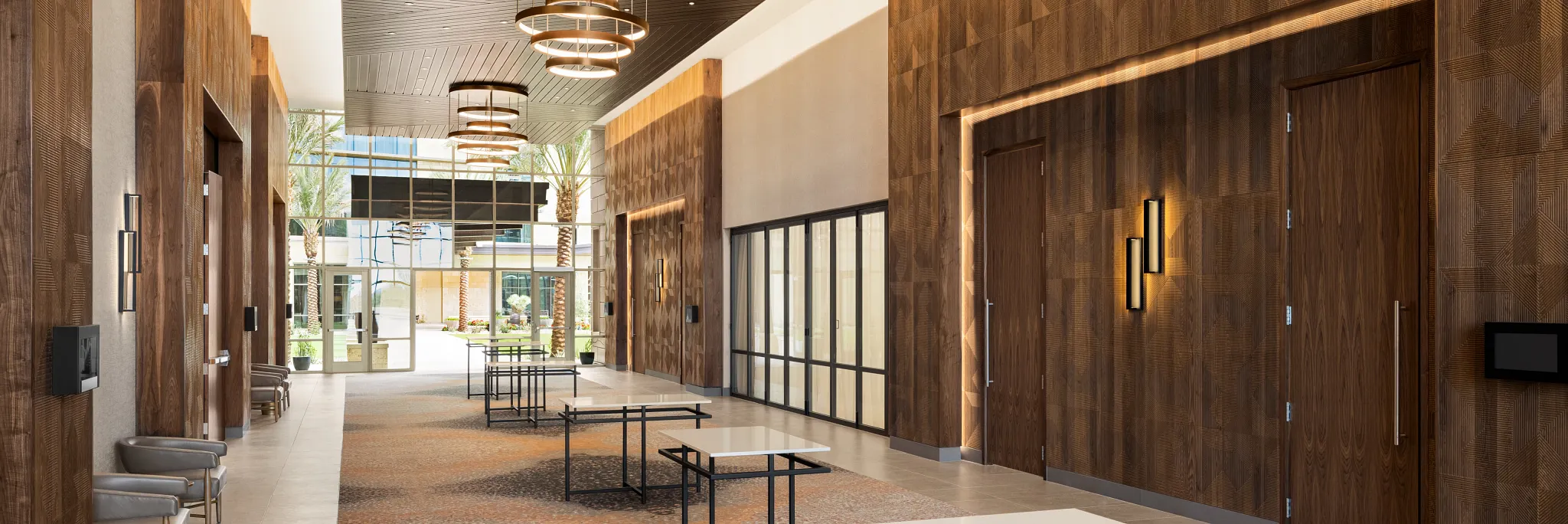Spacious hospitality facility with modern design featuring commercial carpet tile in a blend of brown and beige tones