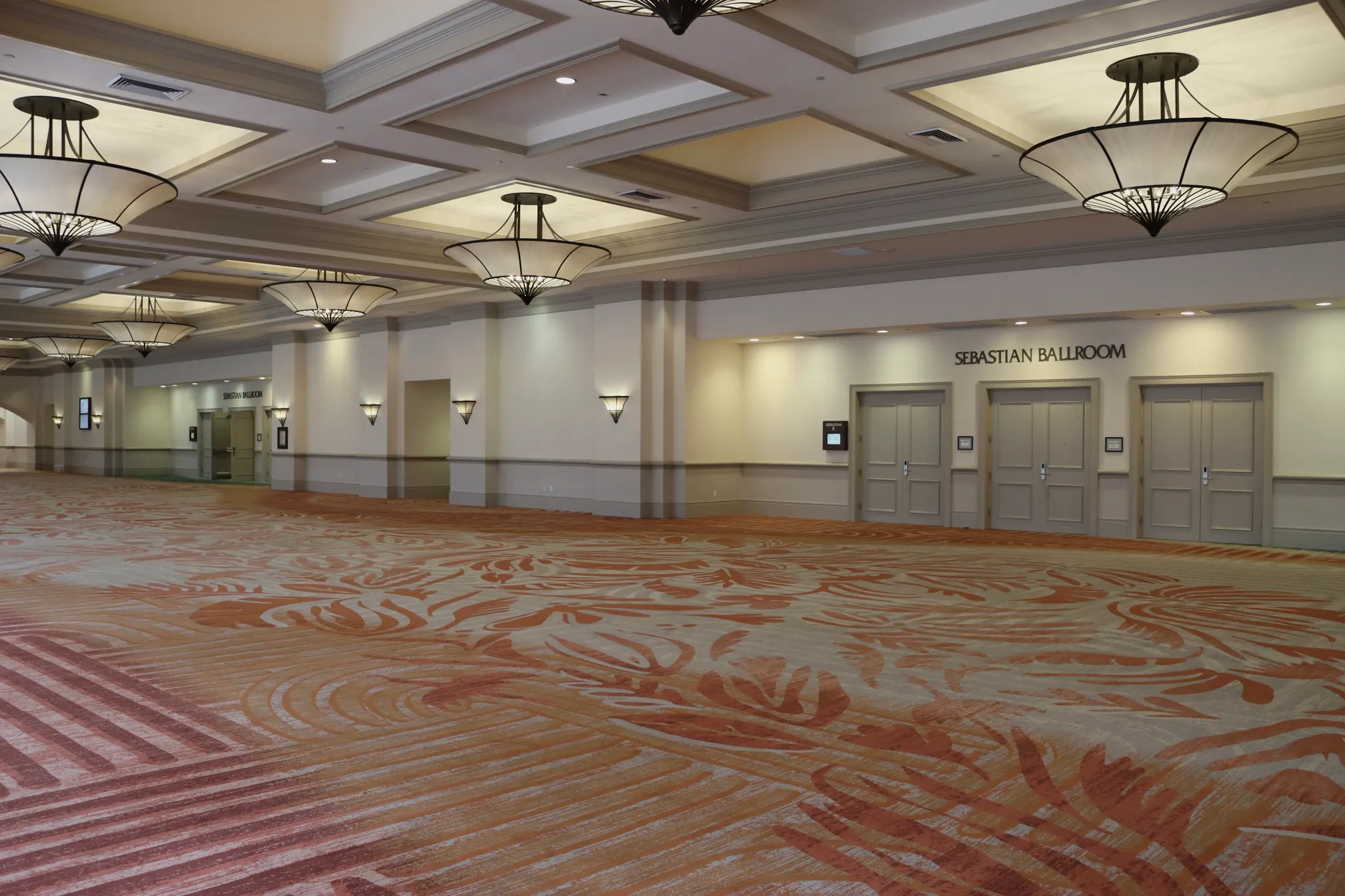 Hotel corridor with red broadloom carpet