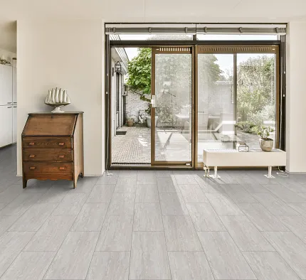 Coretec Residential WPC Luxury Vinyl Tile Flooring - Light Stone Look, 24.02x12.01 inches Modern living room with Coretec Residential WPC luxury vinyl tile flooring in a light stone look, featuring dimensions of 24.02x12.01 inches