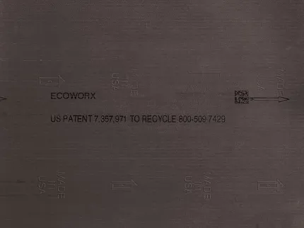 Ecoworx Dark Brown Flooring Swatch with Recycling Details Dark brown flooring swatch with Ecoworx branding and recycling information