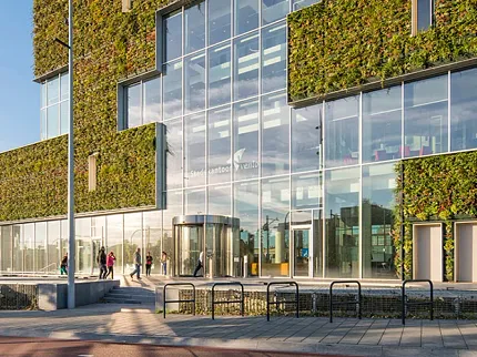 Education Facility Exterior with Green Wall and Glass Facade Modern education facility exterior with green wall and glass facade