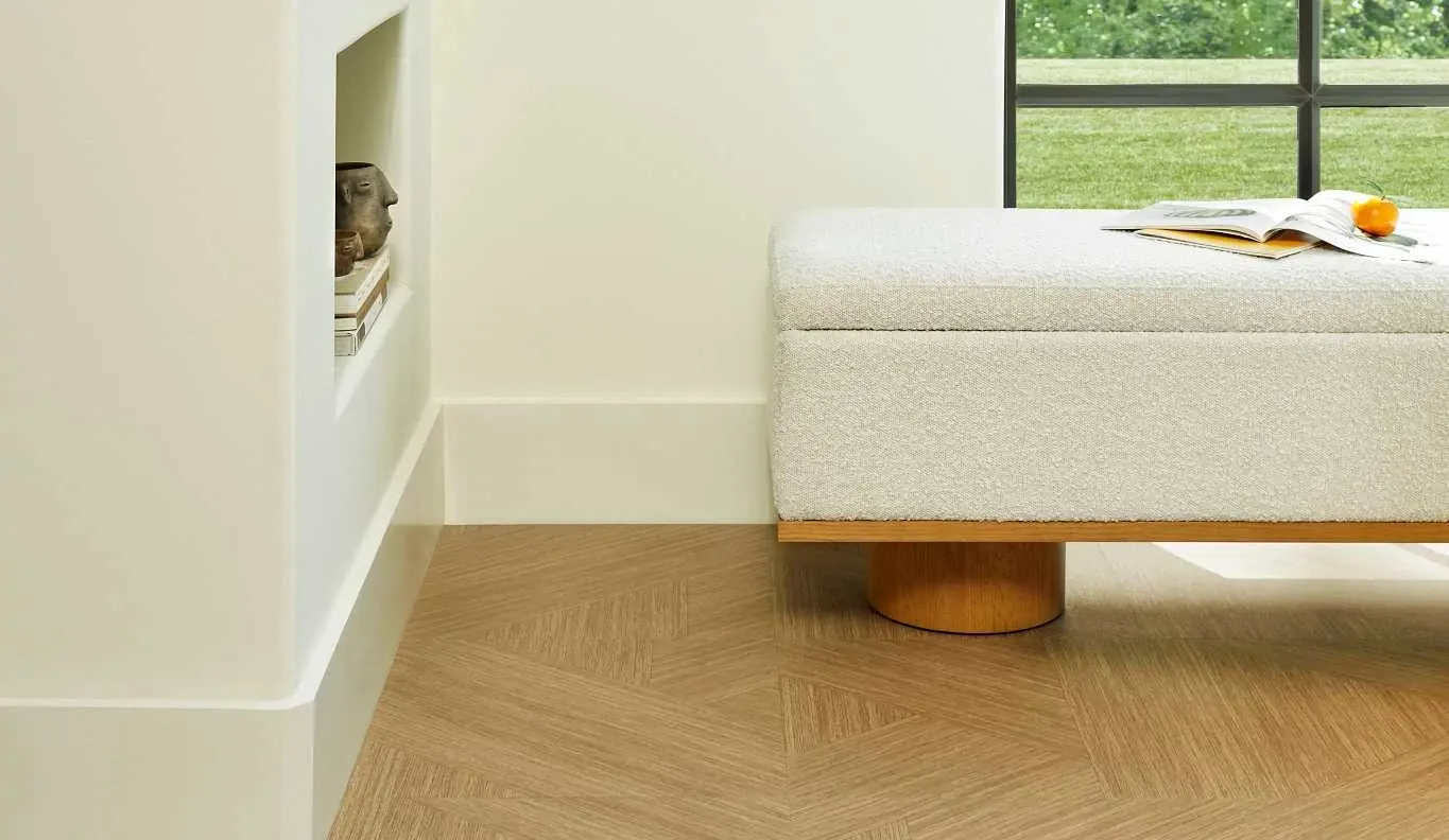 Modern living room with light wood herringbone flooring