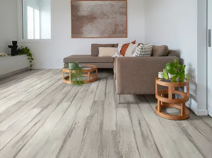Cozy Living Room with Durable Light Wood-Look Flooring Modern living room with light wood-look flooring, brown sectional sofa, and wooden side tables