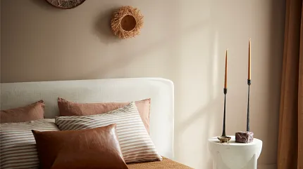bedroom headboard and bedding Bedroom headboard and pillows with bronze tones in strips and solids