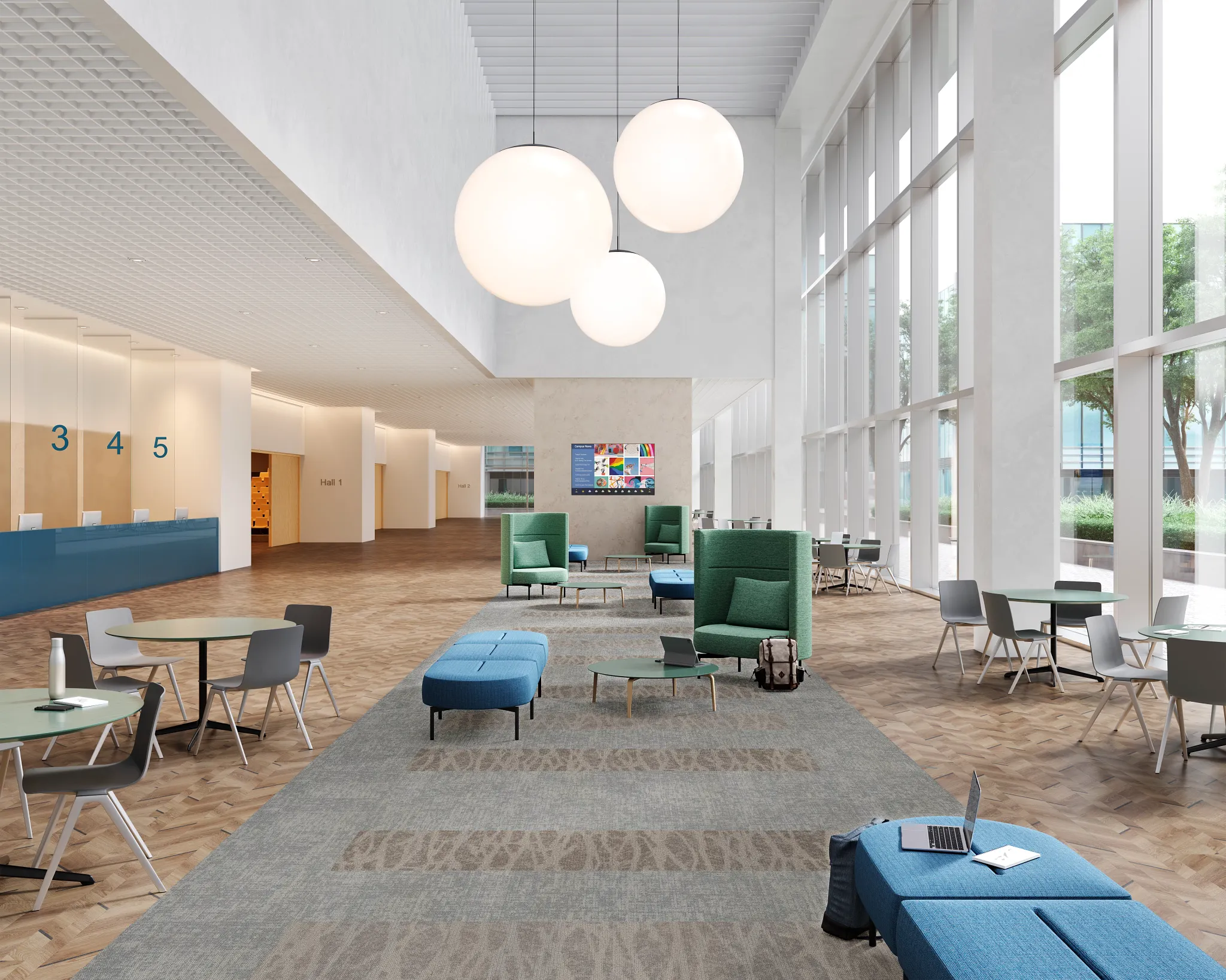 Modern education facility lobby with large windows, contemporary furniture, and mixed flooring of commercial carpet tile and hardwood