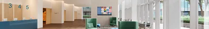 Education Facility Lobby with Mixed Flooring and Modern Design Modern education facility lobby with large windows, contemporary furniture, and mixed flooring of commercial carpet tile and hardwood