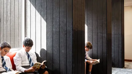 Education Facility with Geometric Patterned Commercial Carpet Tile Flooring Education Facility with young students reading on benches, featuring geometric patterned commercial carpet tile flooring