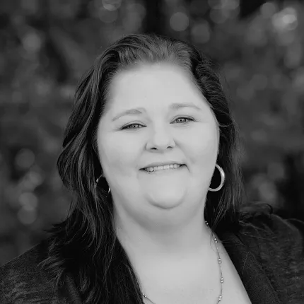 Black and White Portrait of Woman with Long Hair and Hoop Earrings Black and white portrait of a woman with long dark hair and hoop earrings