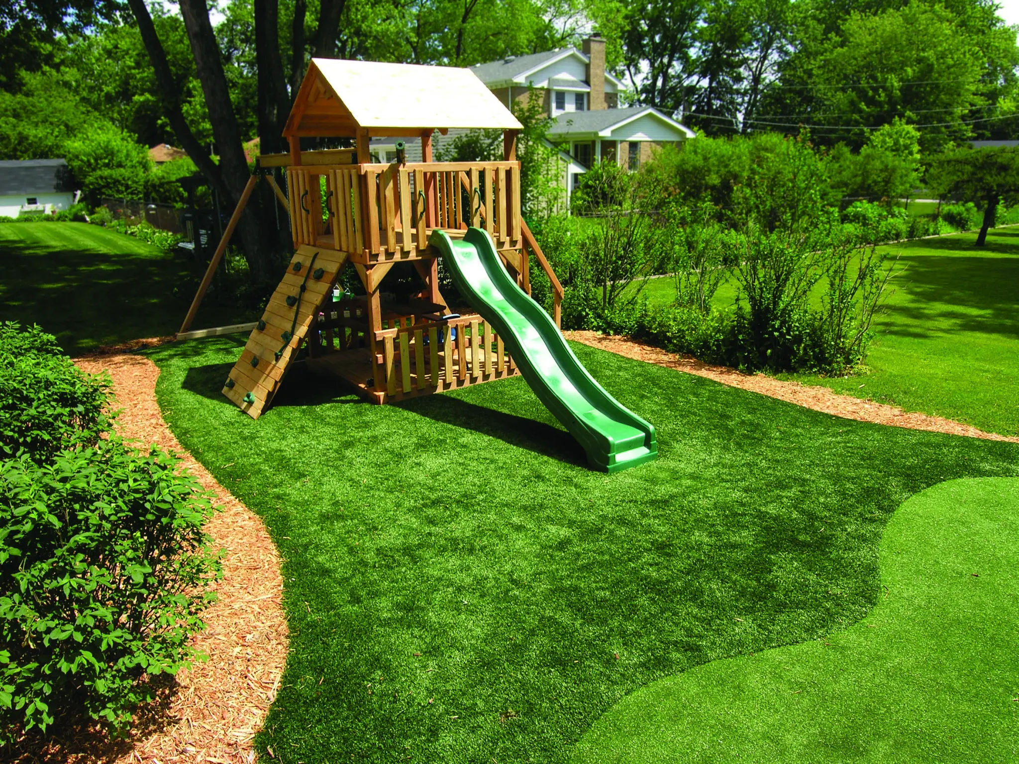 Playground with artificial grass in a backyard