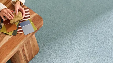 Light Blue Synthetic Carpet with Color Swatches and Wooden Table Light blue synthetic carpet with a wooden table and color swatches