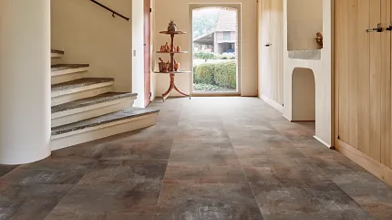 Stone Look Luxury Vinyl Tile Flooring in Modern Hallway Modern hallway with stone look luxury vinyl tile flooring in shades of brown and gray