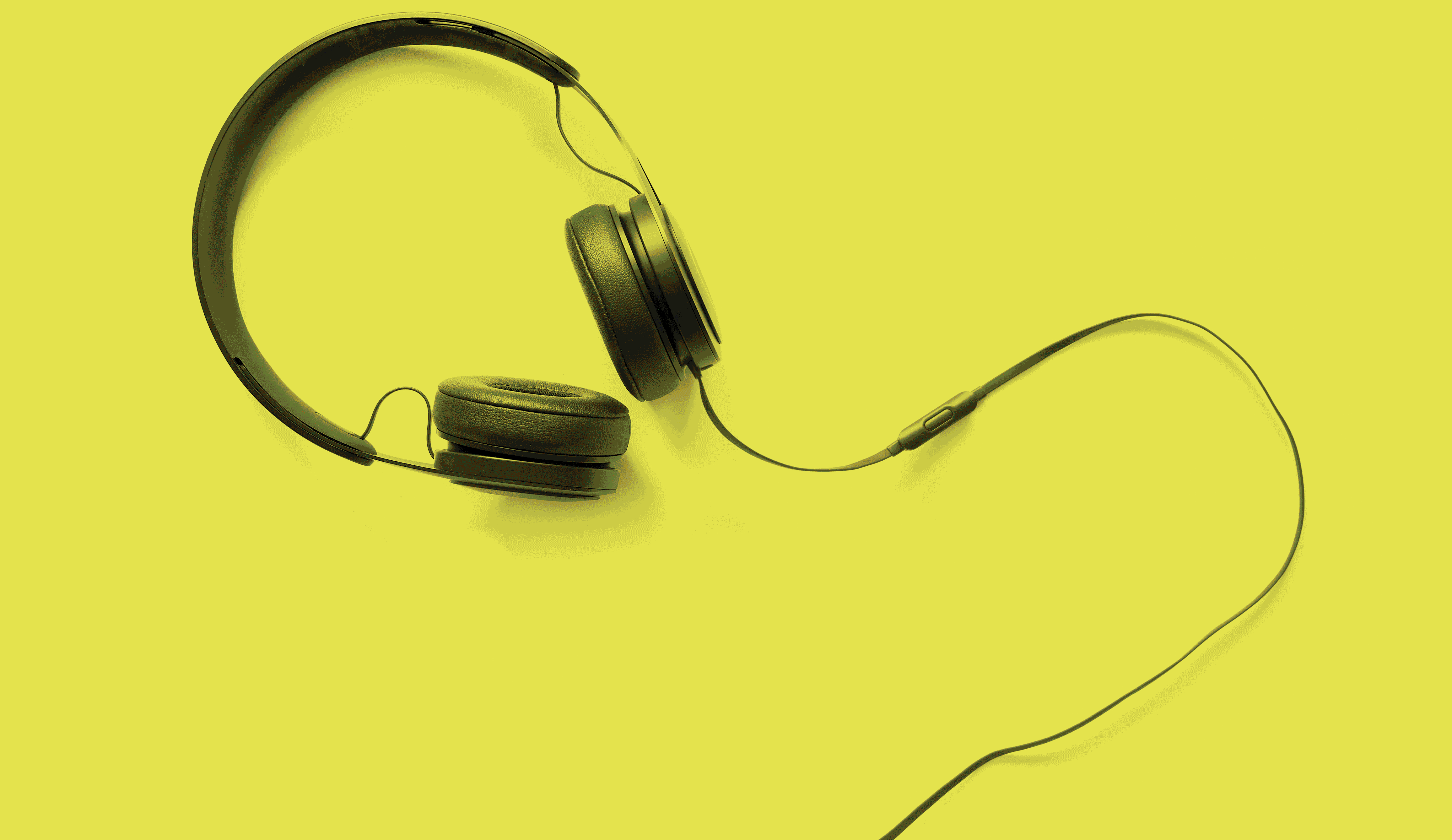 Black Headphones on Yellow Background
