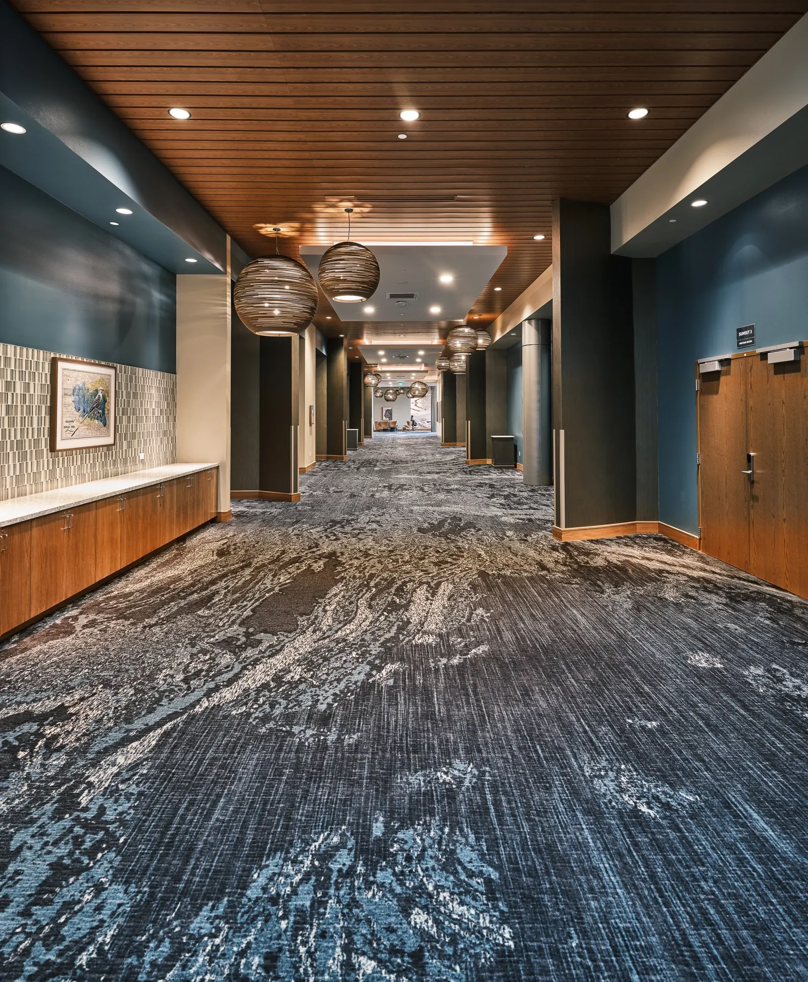 Modern hallway with patterned carpet flooring
