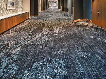 Stylish carpet design in contemporary corridor Modern hallway with patterned carpet flooring
