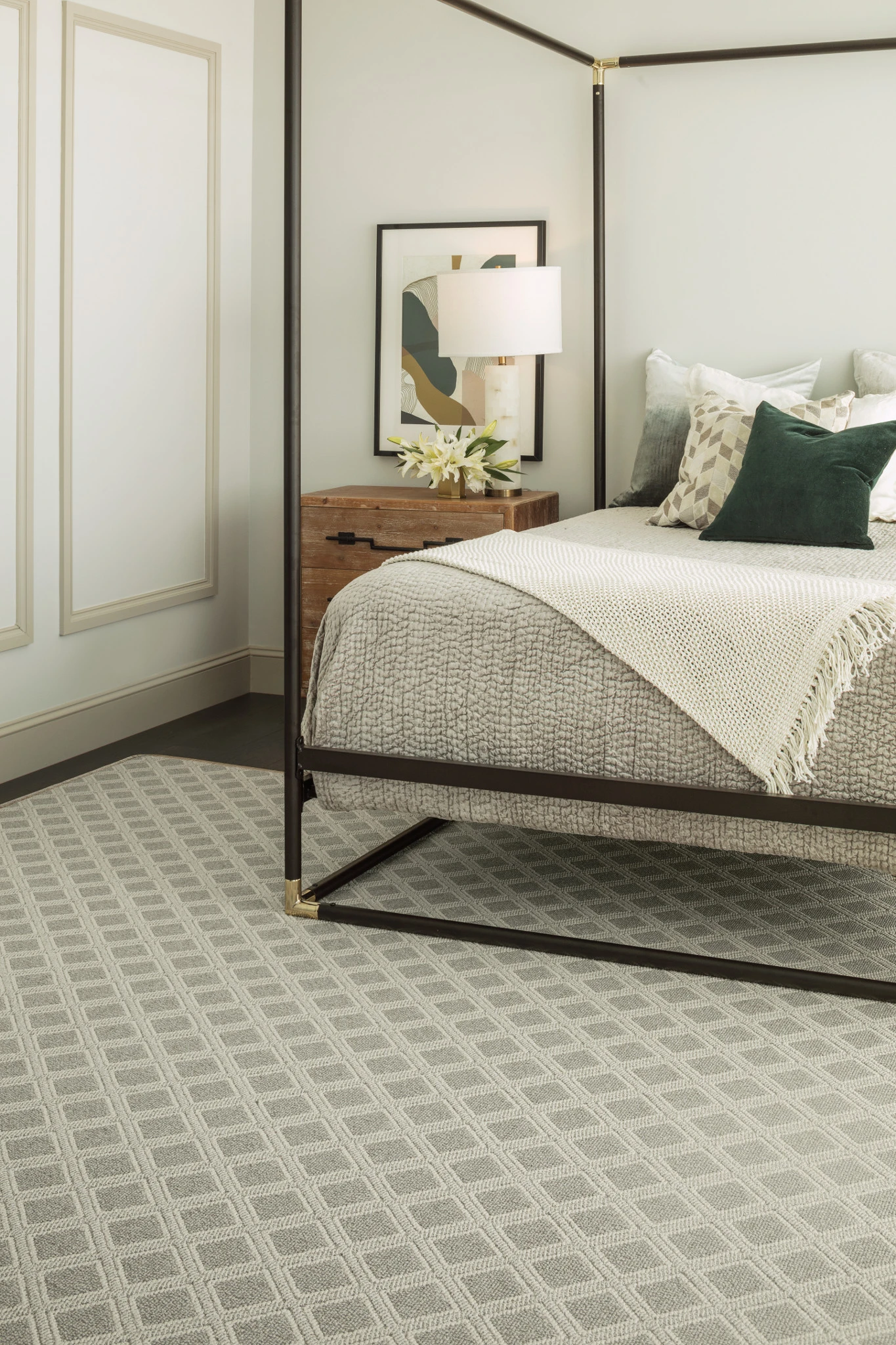 Elegant bedroom featuring a geometric patterned carpet in shades of gray
