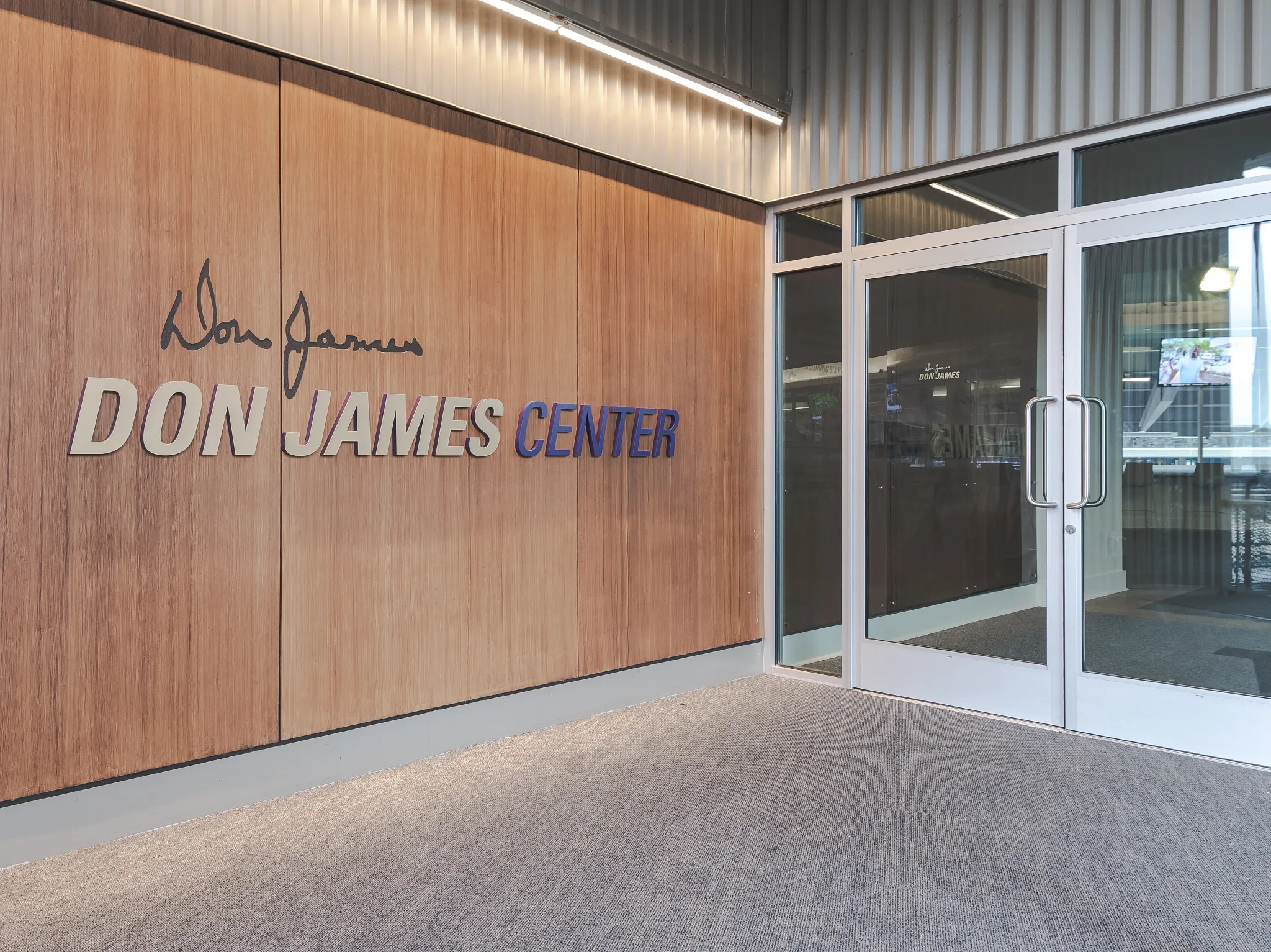 Entrance of Don James Center with commercial carpet flooring in an education facility