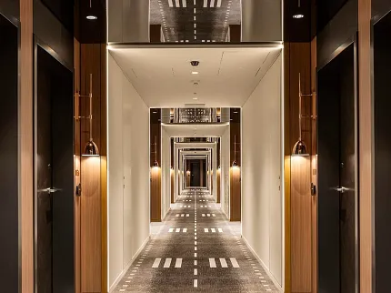 Stylish carpet design for contemporary hotel interiors Modern hotel corridor with patterned carpet flooring