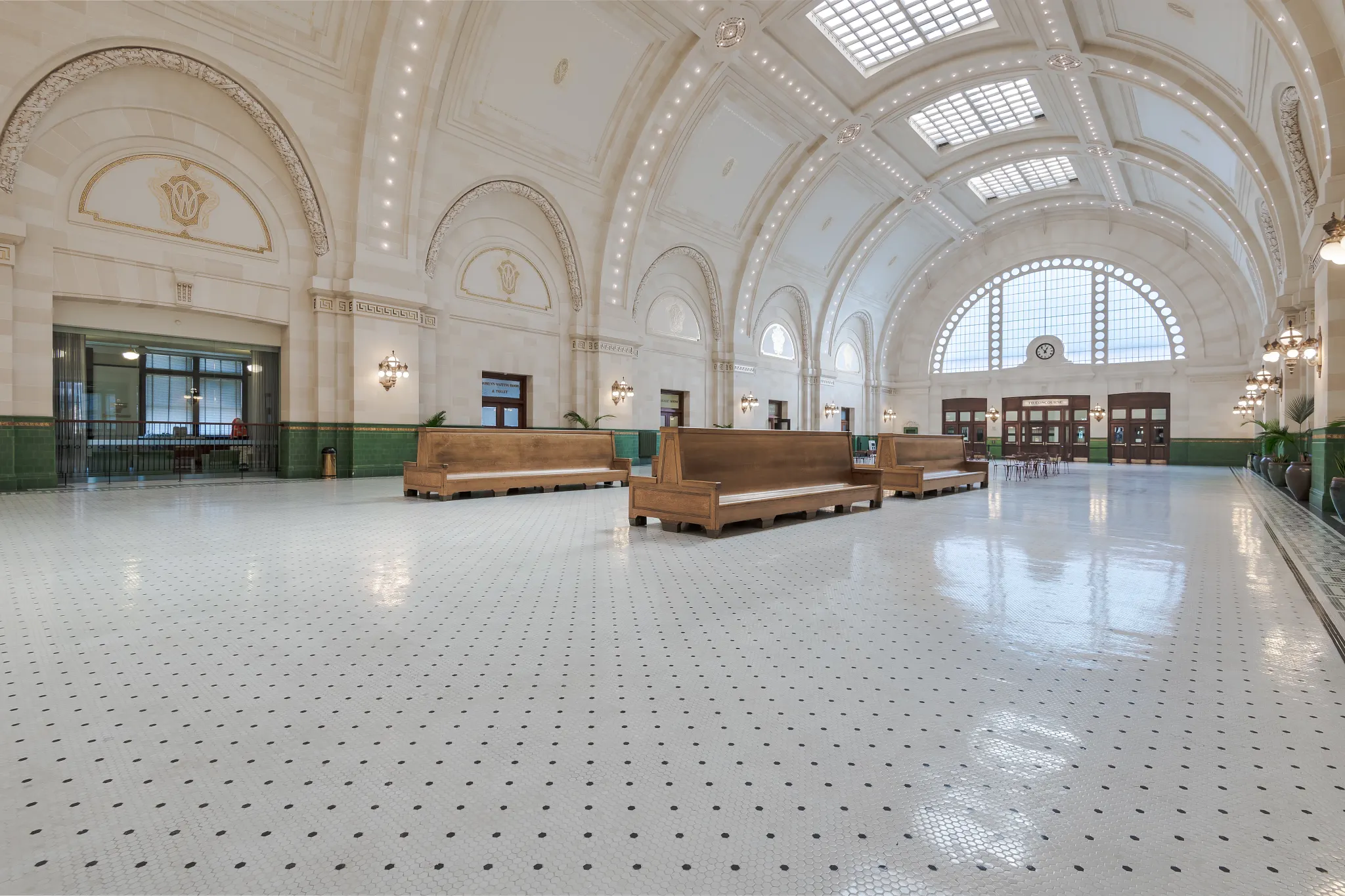 Government space with historic interior designs with white LVT tile with black dots