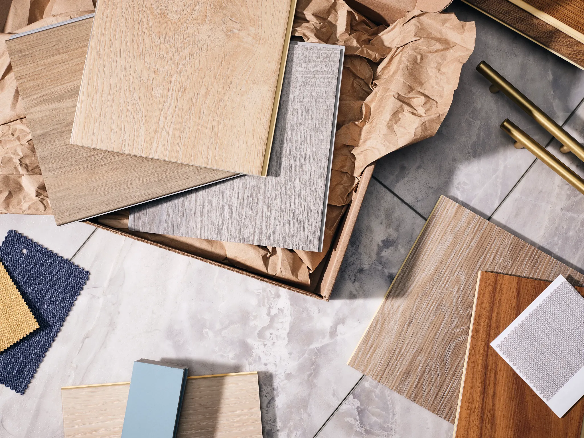 Assorted flooring samples including wood and tile textures