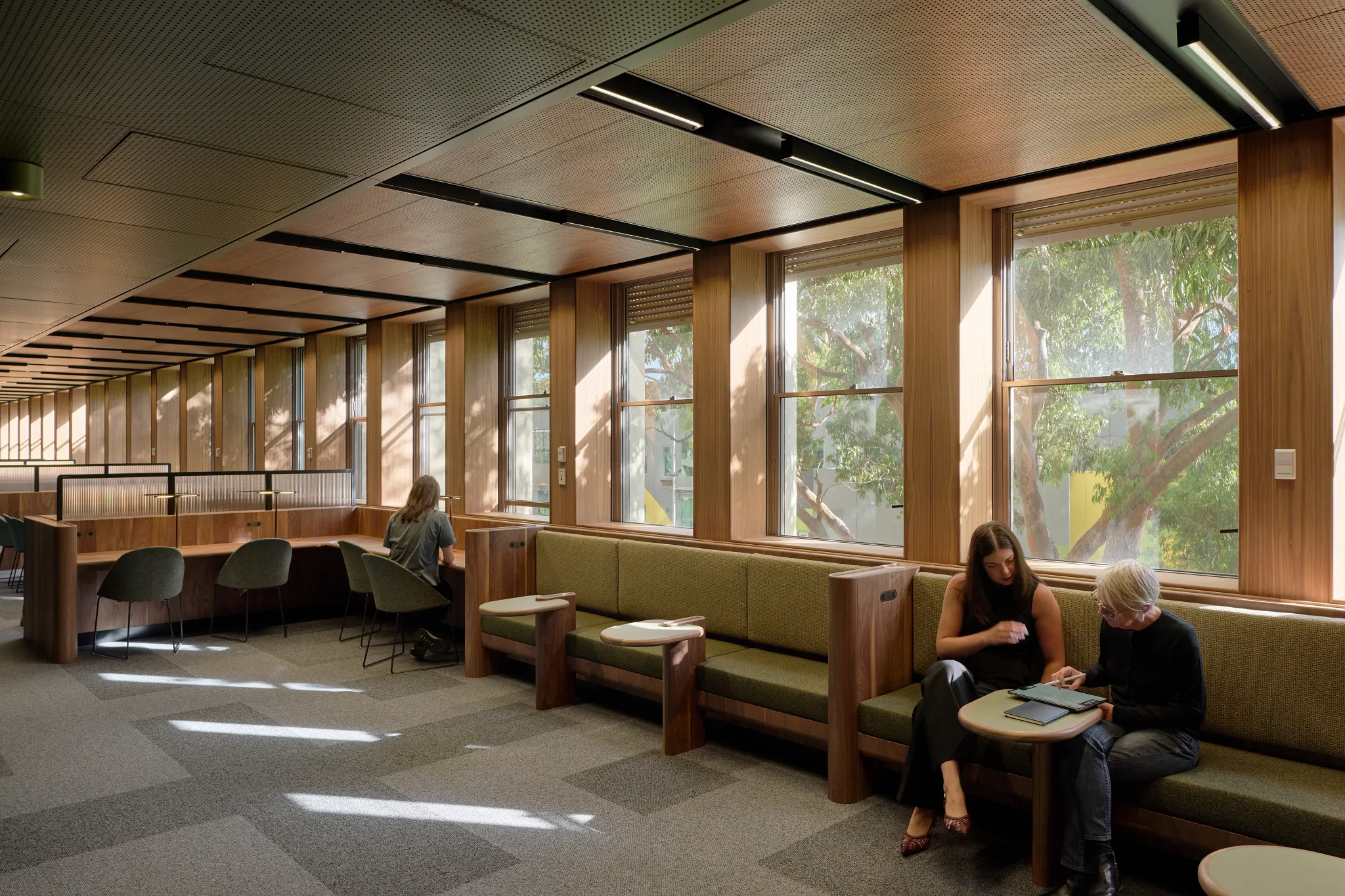 Learning and collaboration area within the Monash University Clayton Menzies Building Level 1 Teaching Space Upgrades project by Hayball, featuring custom timber joinery, study booths and informal meeting spaces.