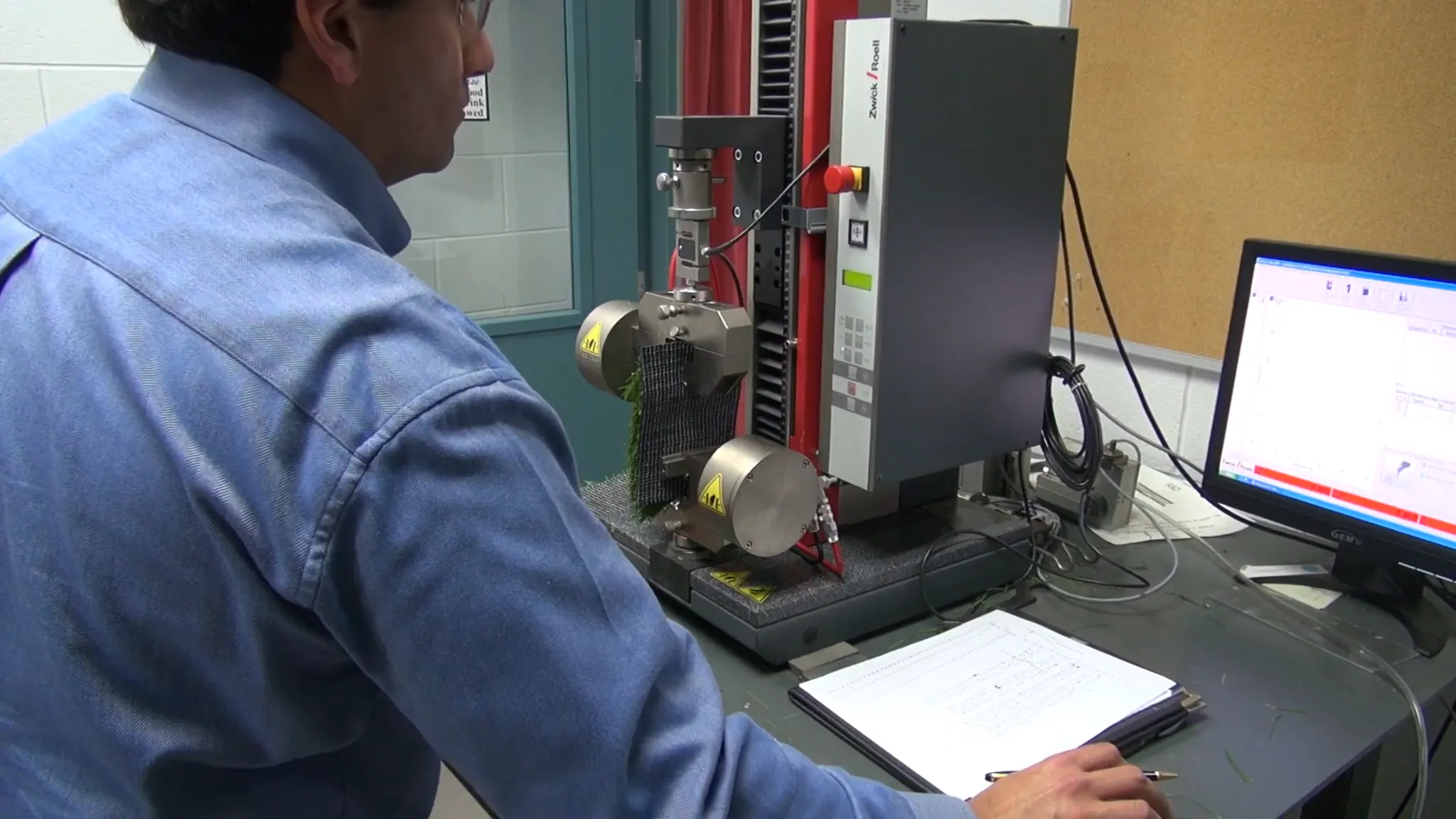Technician conducting flooring durability test in laboratory