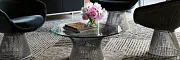 Contemporary Office Lounge with Commercial Carpet Tile Flooring Modern office lounge with abstract art and plush black chairs on patterned commercial carpet tile
